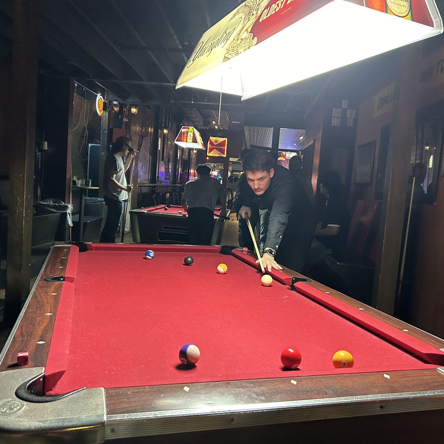 The inspiration for our engagement photoshoot came from our ritual of playing pool at Cutter's bar in Athens every weekend since our first date.