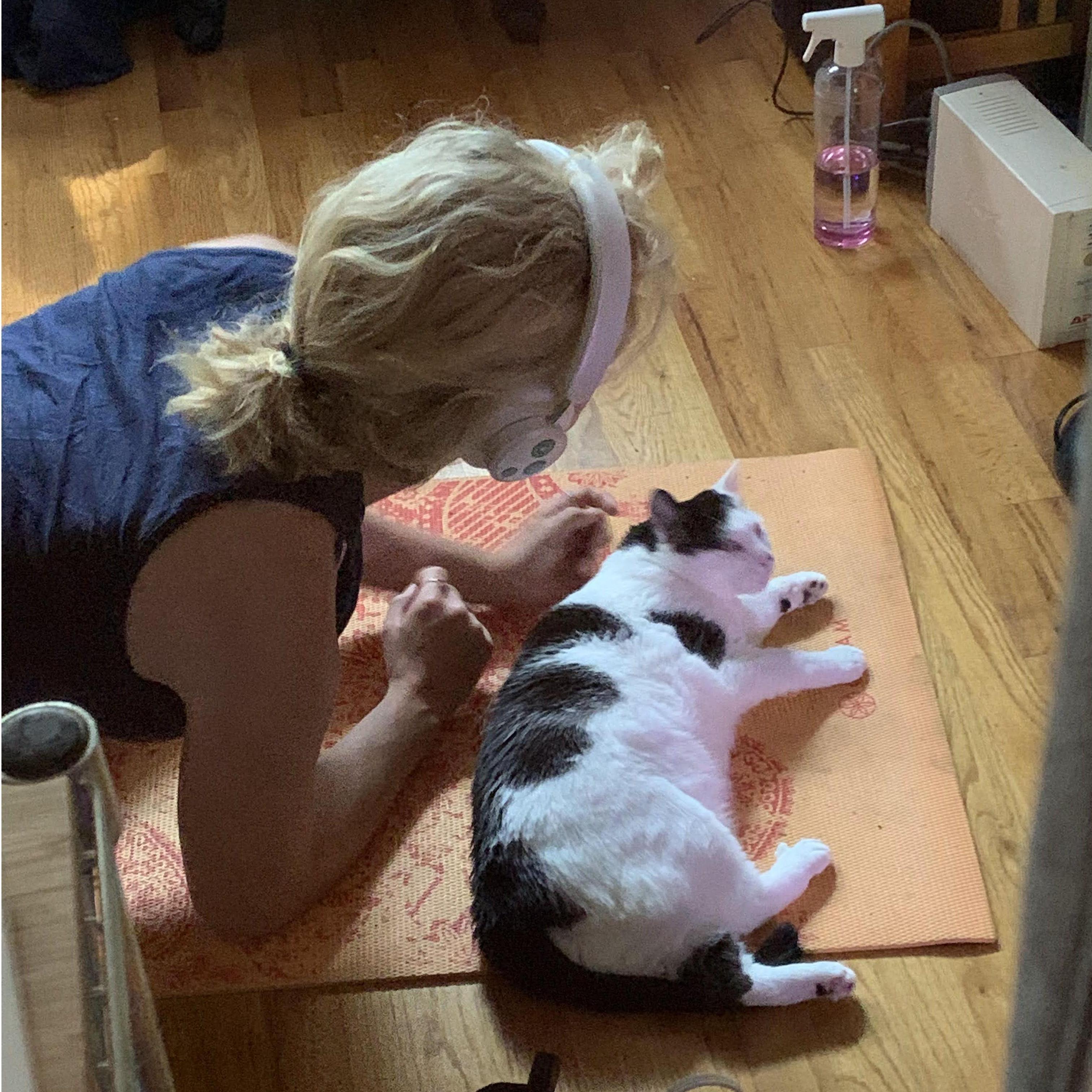 Emily is trying to do yoga but her mat is too comfy.