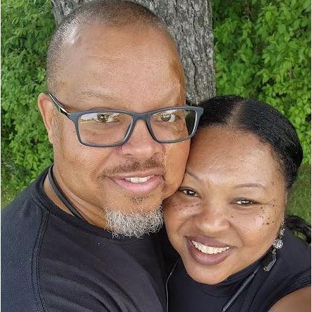 He loves the outdoors; she doesn't, but she loves him so she goes out to the park for walks with him so he can enjoy time in nature with his favorite girl.