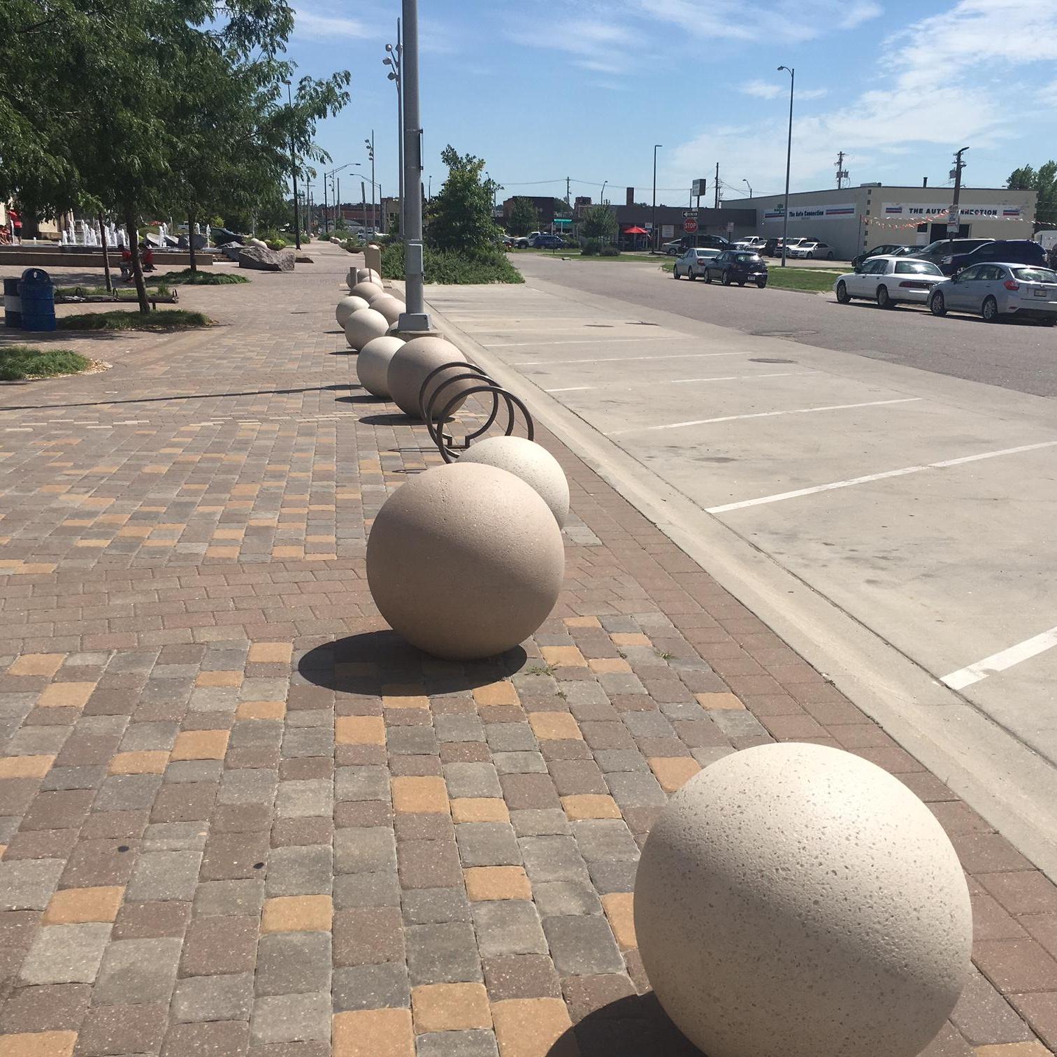 Parking in front of the Amphitheater.  You'll know you're in the right place if you're in front of The Hub restaurant and the Jayne Synder Bike Trails Center.