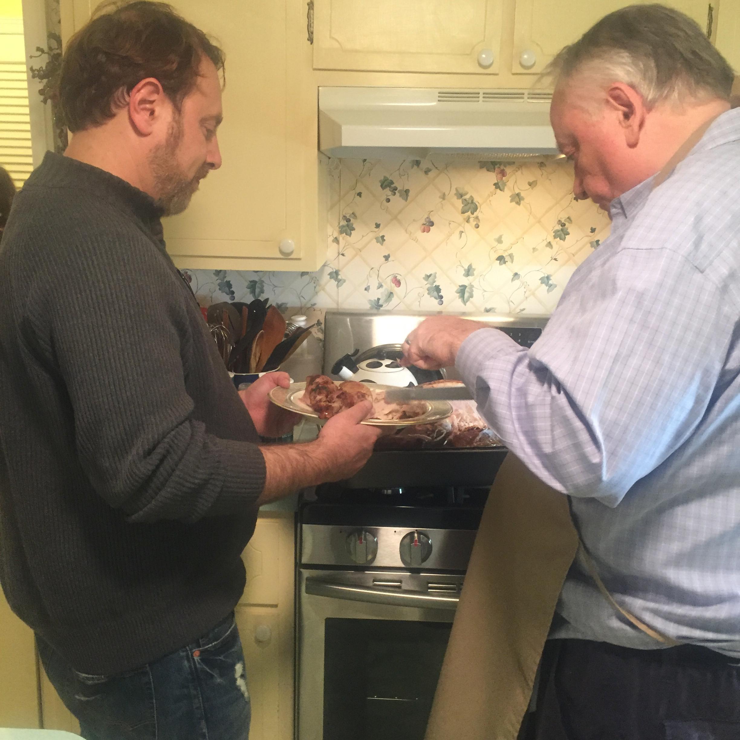 Henry helping Jane's dad with Thanksgiving preparations.