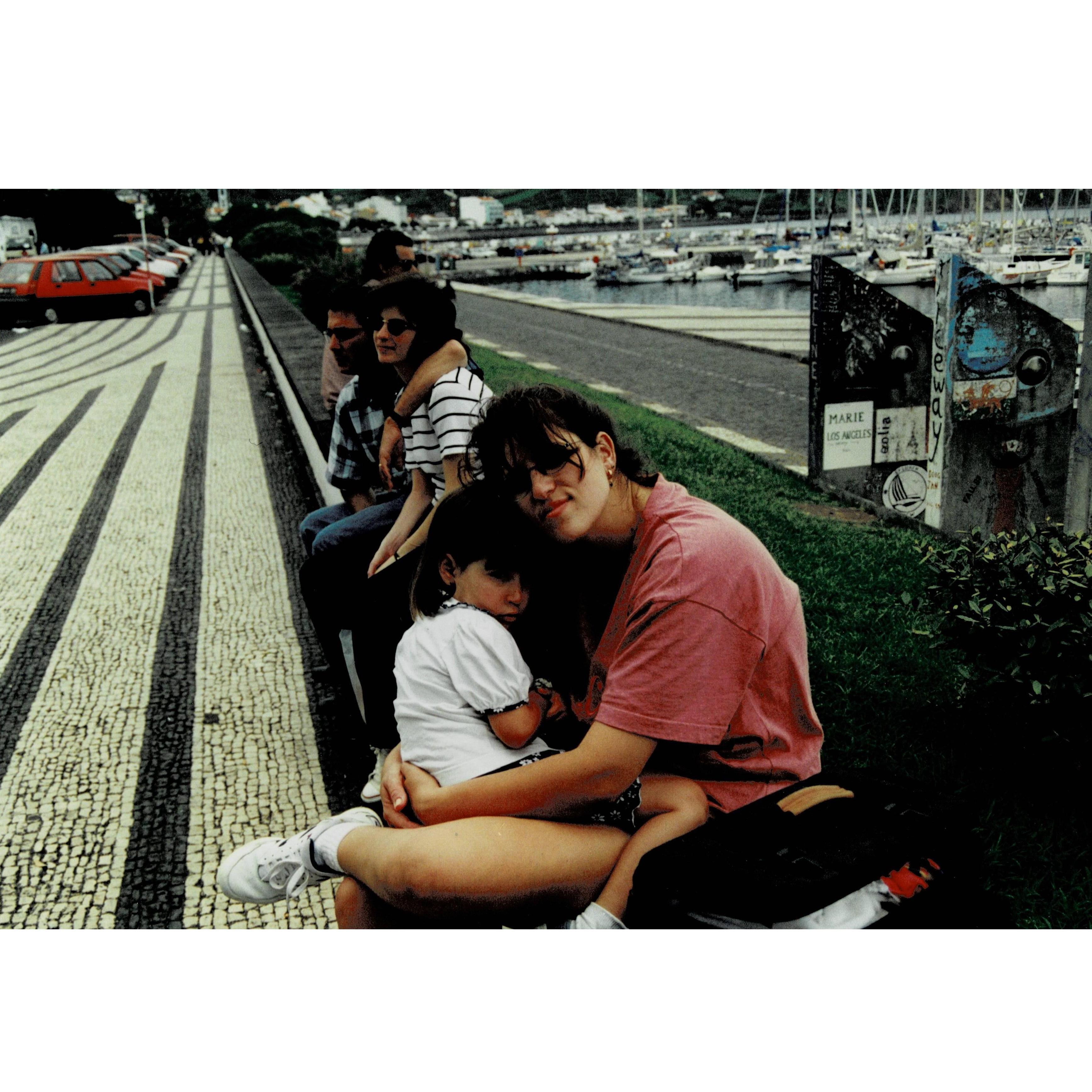 Marina, her mom, godmother and uncle sitting by the Marina on Faial Island