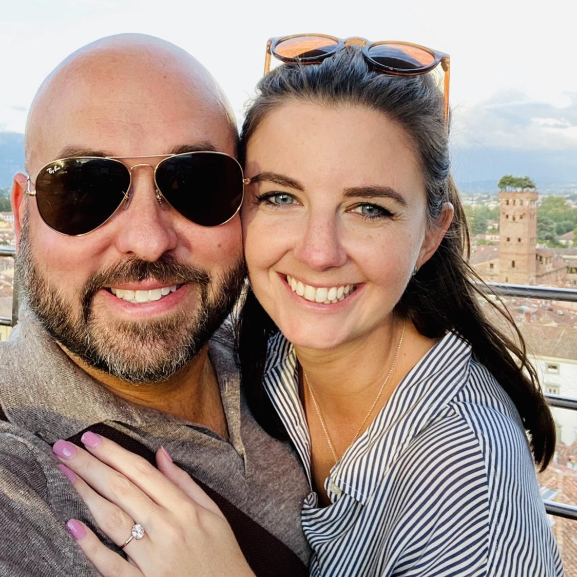 The tip top of a tower in a Tuscan town. Notice the trees growing out of the tower behind us.
