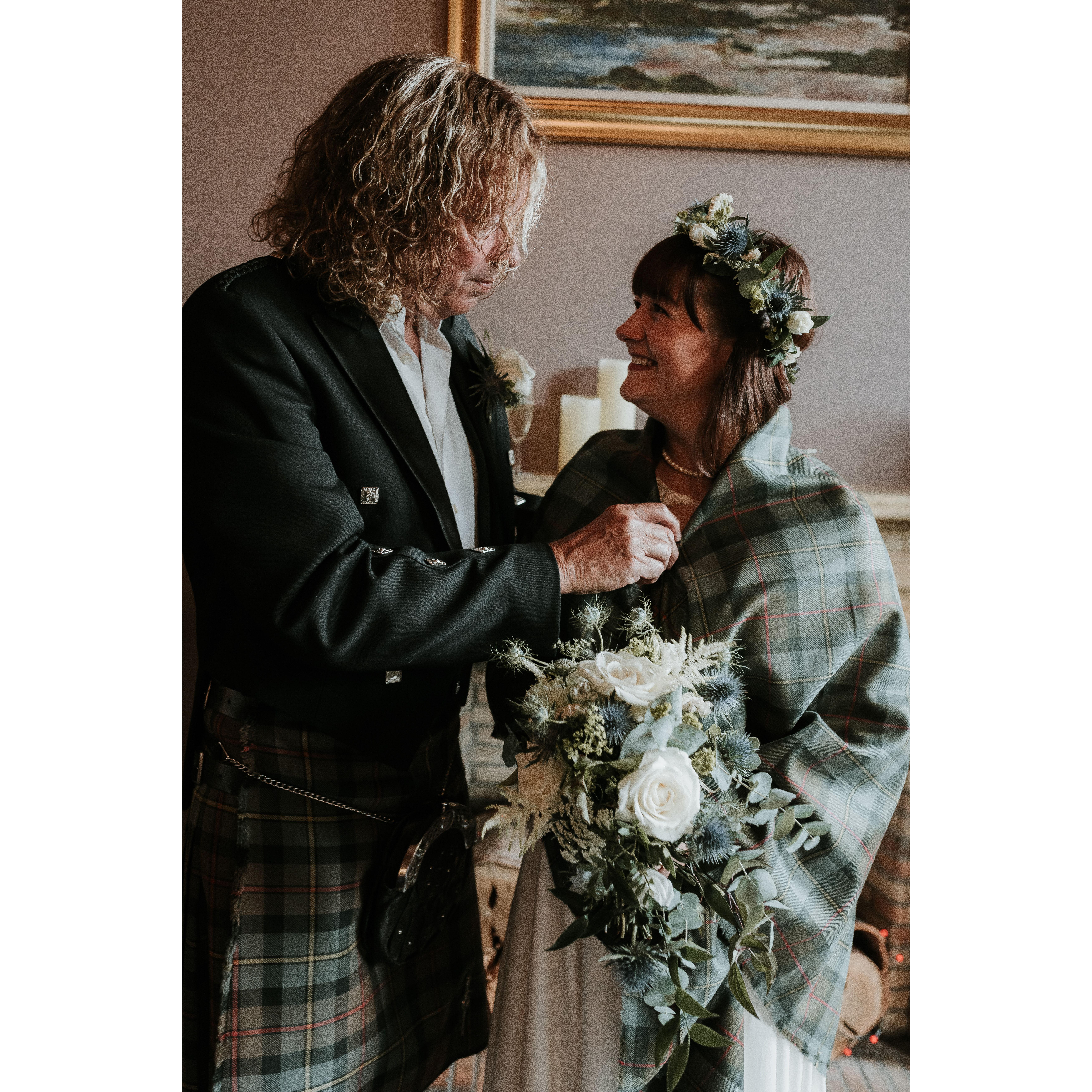 wrapping the bride in the groom's tartan