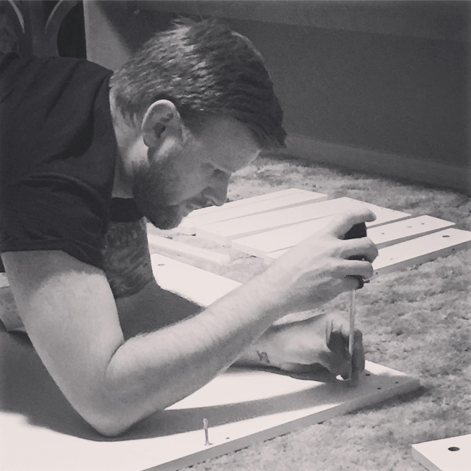 Kevin fixin' stuff, Linzie loves that!