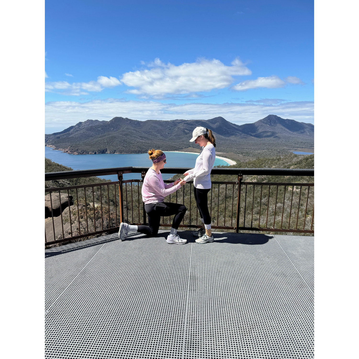 On 12/18/24, Caroline’s sister Jessica flew from the UK to help with a secret mission. After a tough climb up Wineglass Bay’s steps in Tasmania, Caroline asked Shana to marry her - and she said yes!