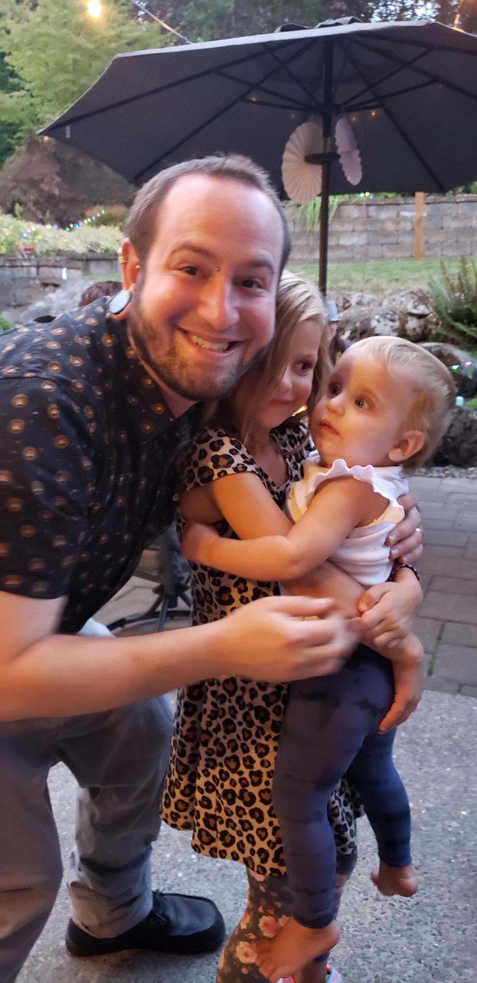 Hall with our youngest nieces Alajay and baby Rocket at our engagement party in our backyard 2019