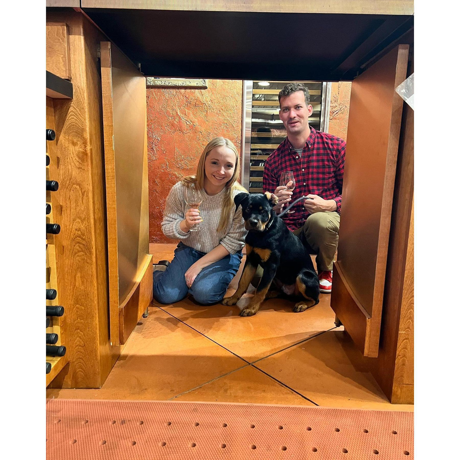 Kyle and Chelby tasting wine in Wisconsin with their best pal, Max!