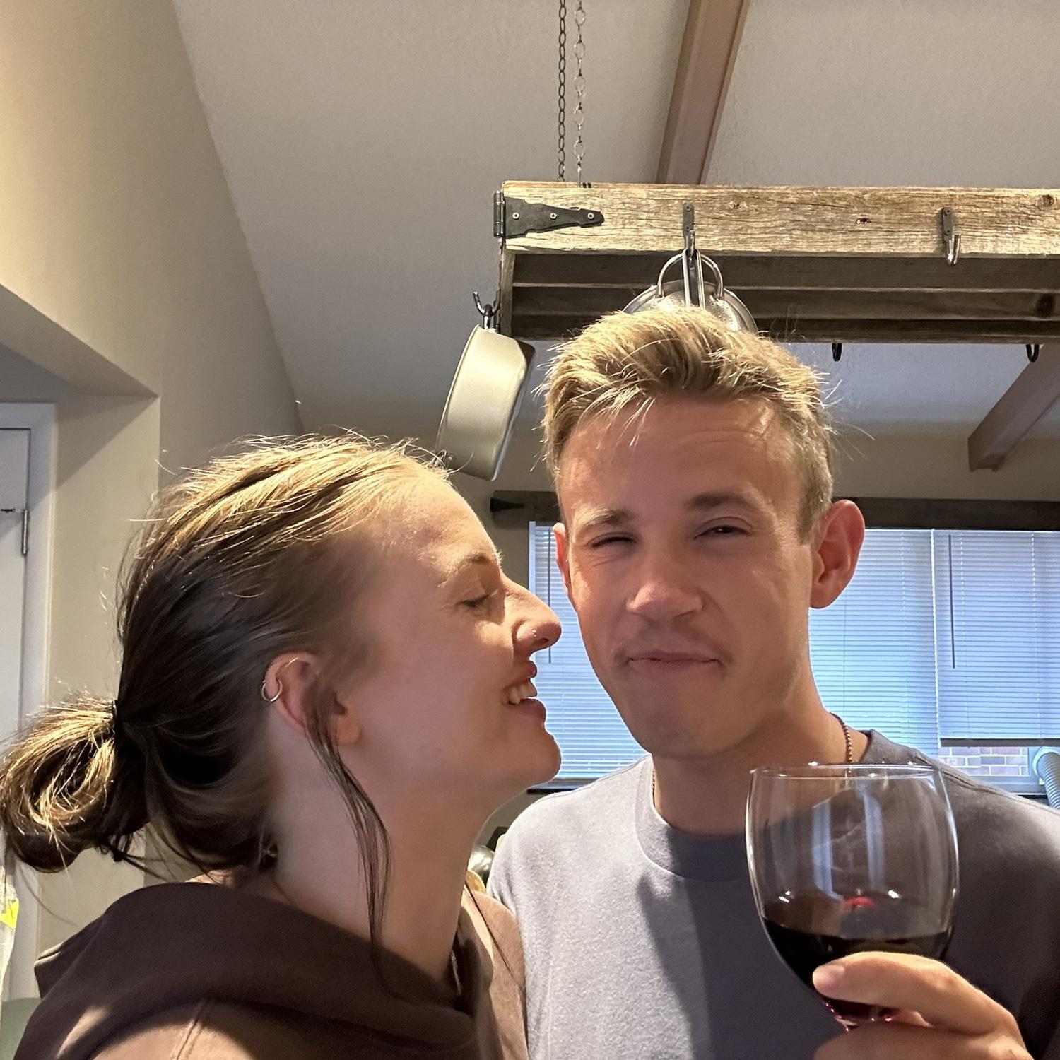 Cason wanting to take a cute picture drinking wine.. he doesn't like wine