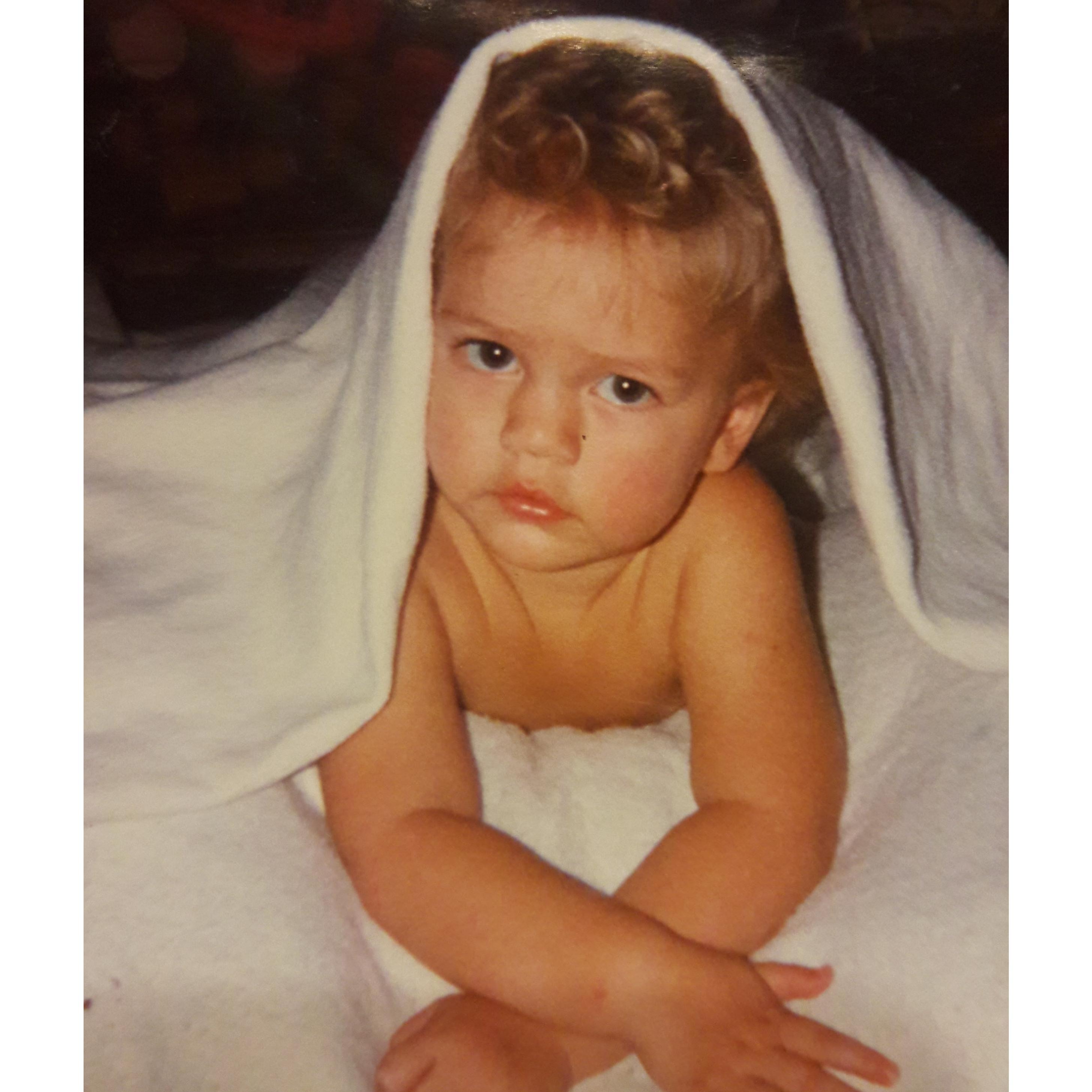 Adorable baby groom posing for pictures.