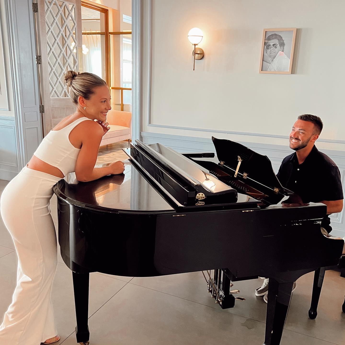 Kaitlyn admiring the Piano man