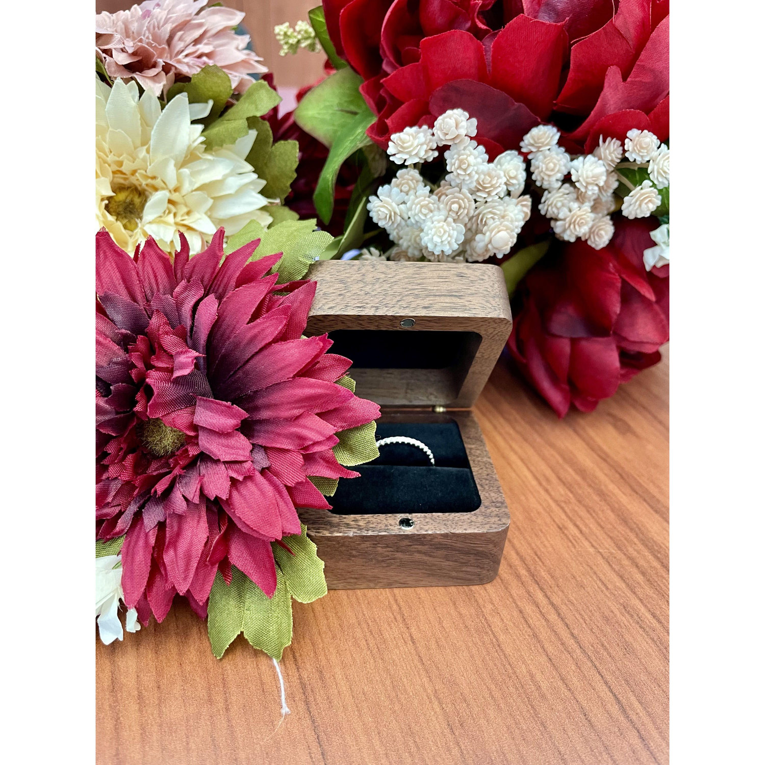 Sarah's ring and handmade bouquet and boutonniere before the ceremony.