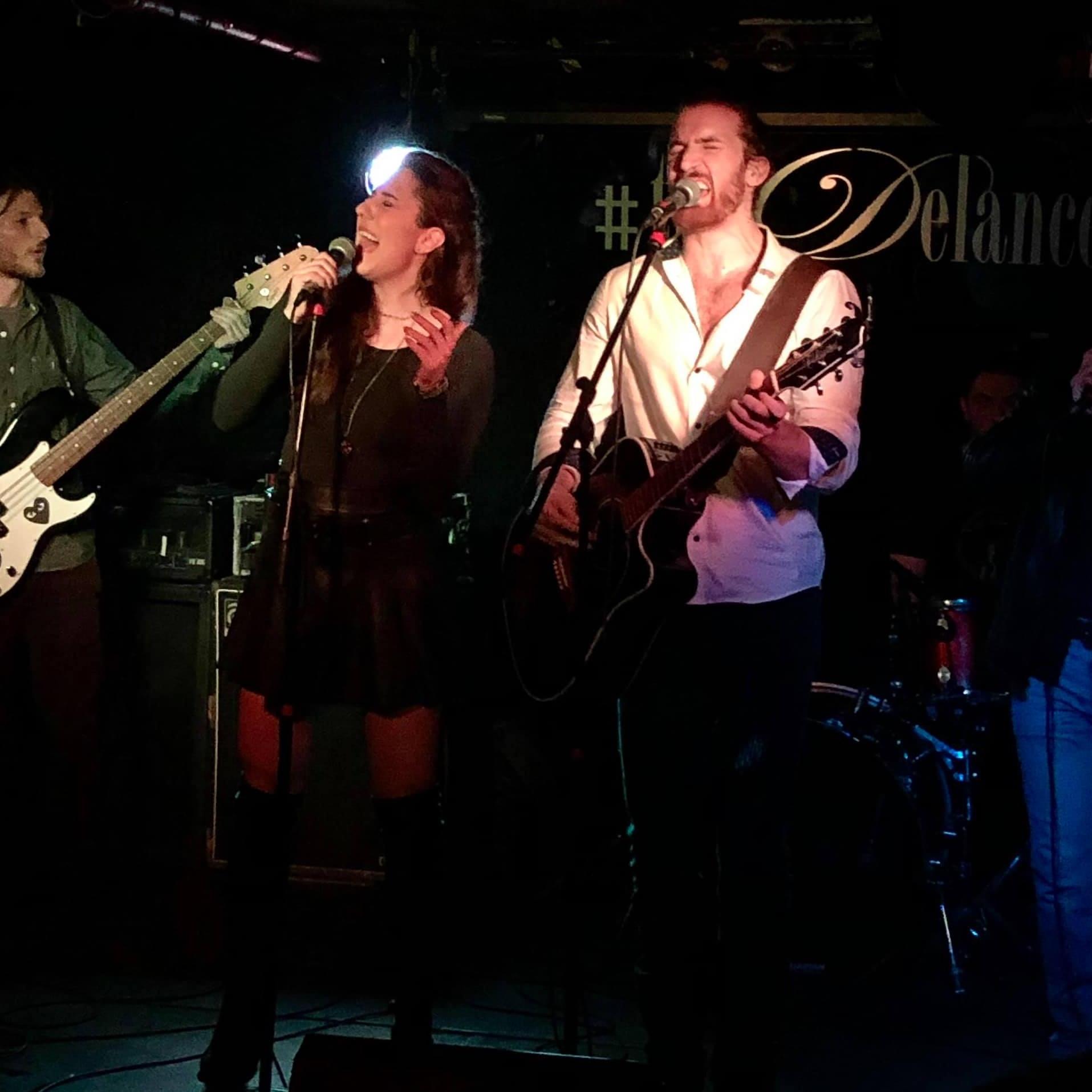On stage at the Delancey in the Village