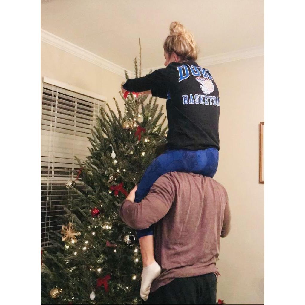 Teamwork makes the dream work especially when you pick a Christmas tree that is over 8 feet tall :)