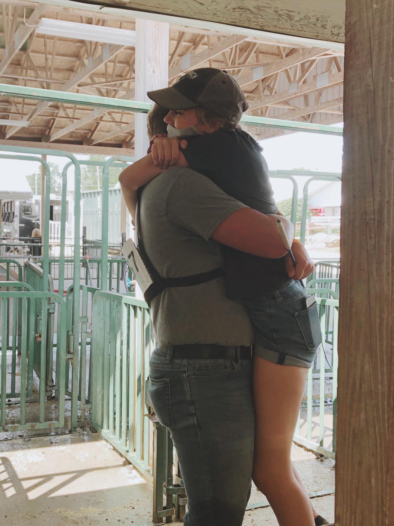 This photo is so special because it was taken right after Josh won Grand Champion Barrow and I ran into his arms! July 31, 2020