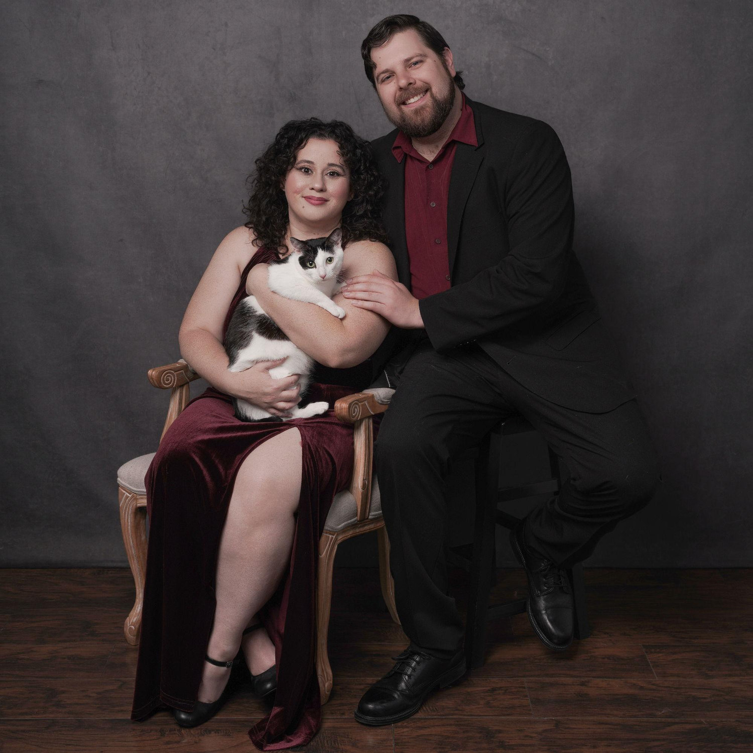 Stephanie won a portrait session with a photographer. It was 100% worth it to drug our cat to take photos with us. One day we will have a fireplace to hang this above. (Jun. 2025)
