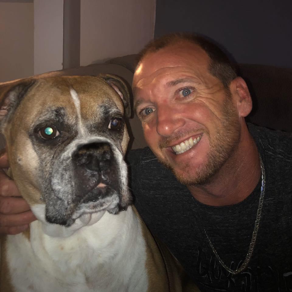 Bryan + his first love, Lexy! Our family fur baby!