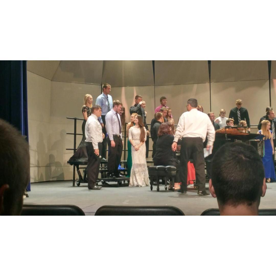 High school senior pop show. Our choir director always stuck us next to each other, even though we'd spend the entire rehearsal whispering and making each other laugh.