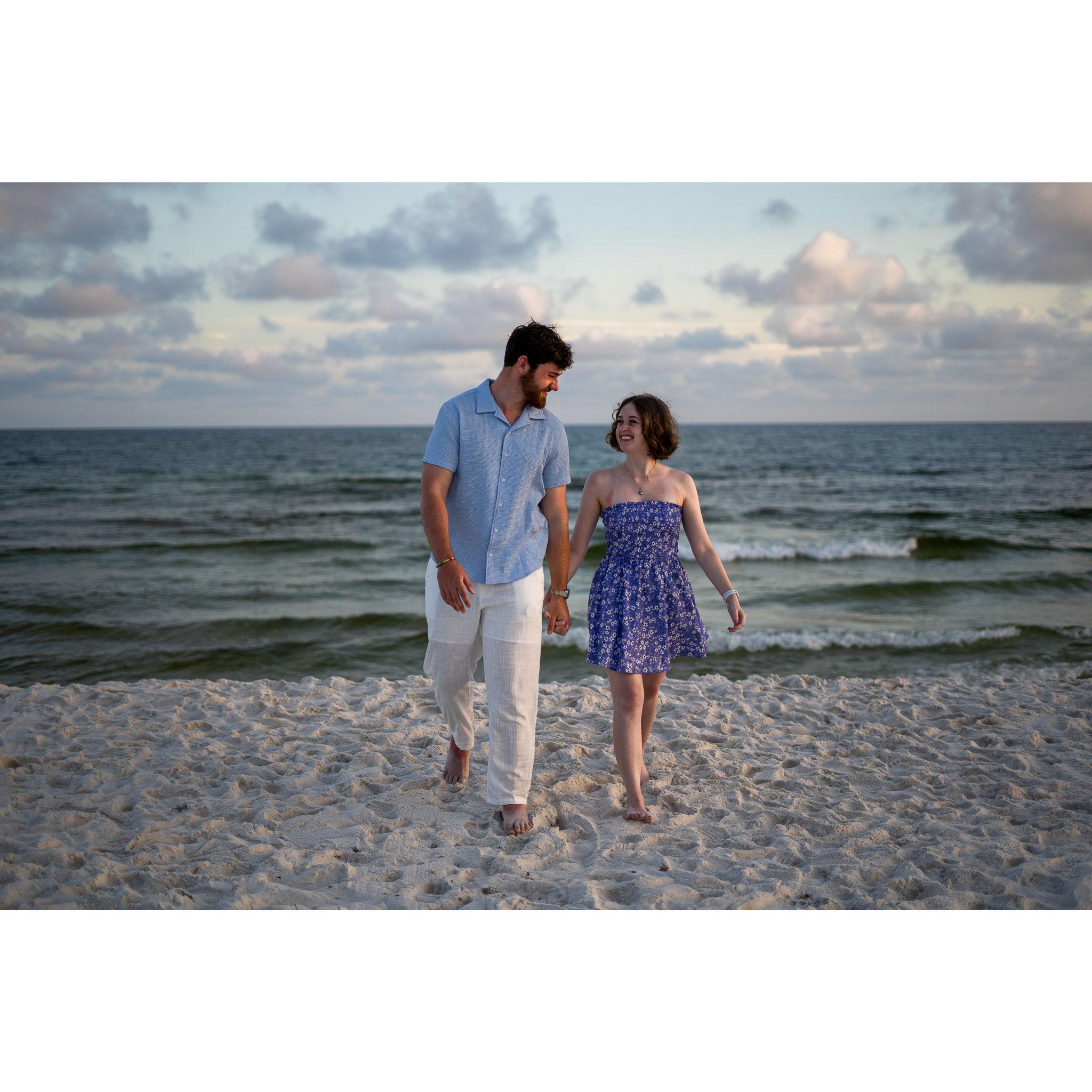 Us taking photos on the beach that we "joked" looked like engagement photos. We knew what we were doing.
