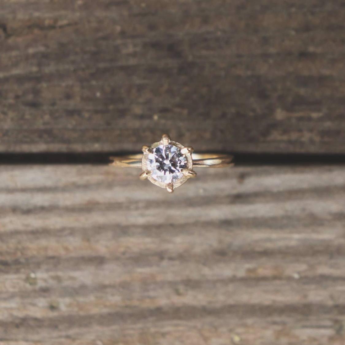 Our engagement ring hand crafted with 14k gold and diamond by Hew Jewelry 