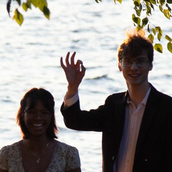 Kyle signaling for family and friends to come out after a successful proposal!