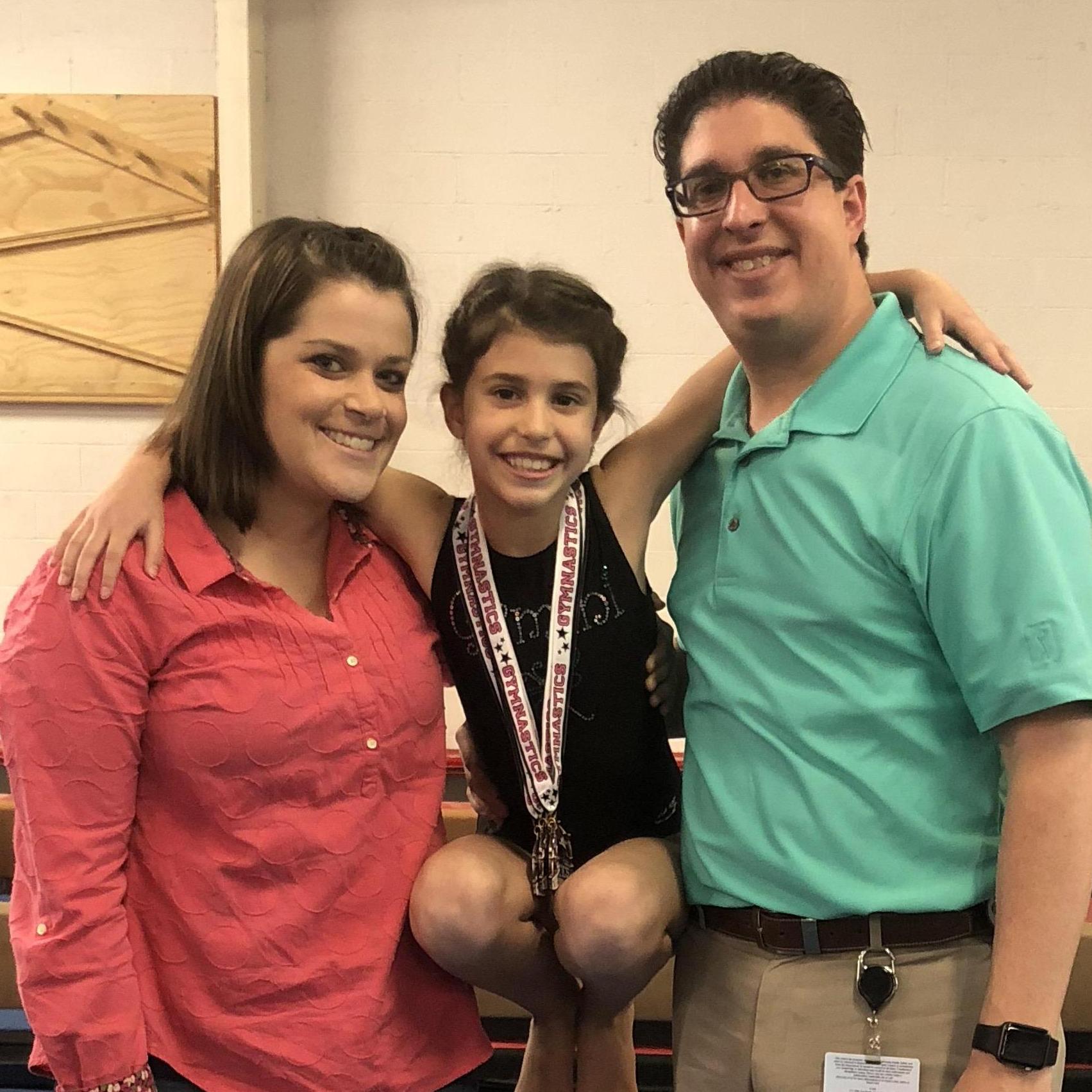 Eli, Addy and Steven after one of Addy's gymnastic competitions.