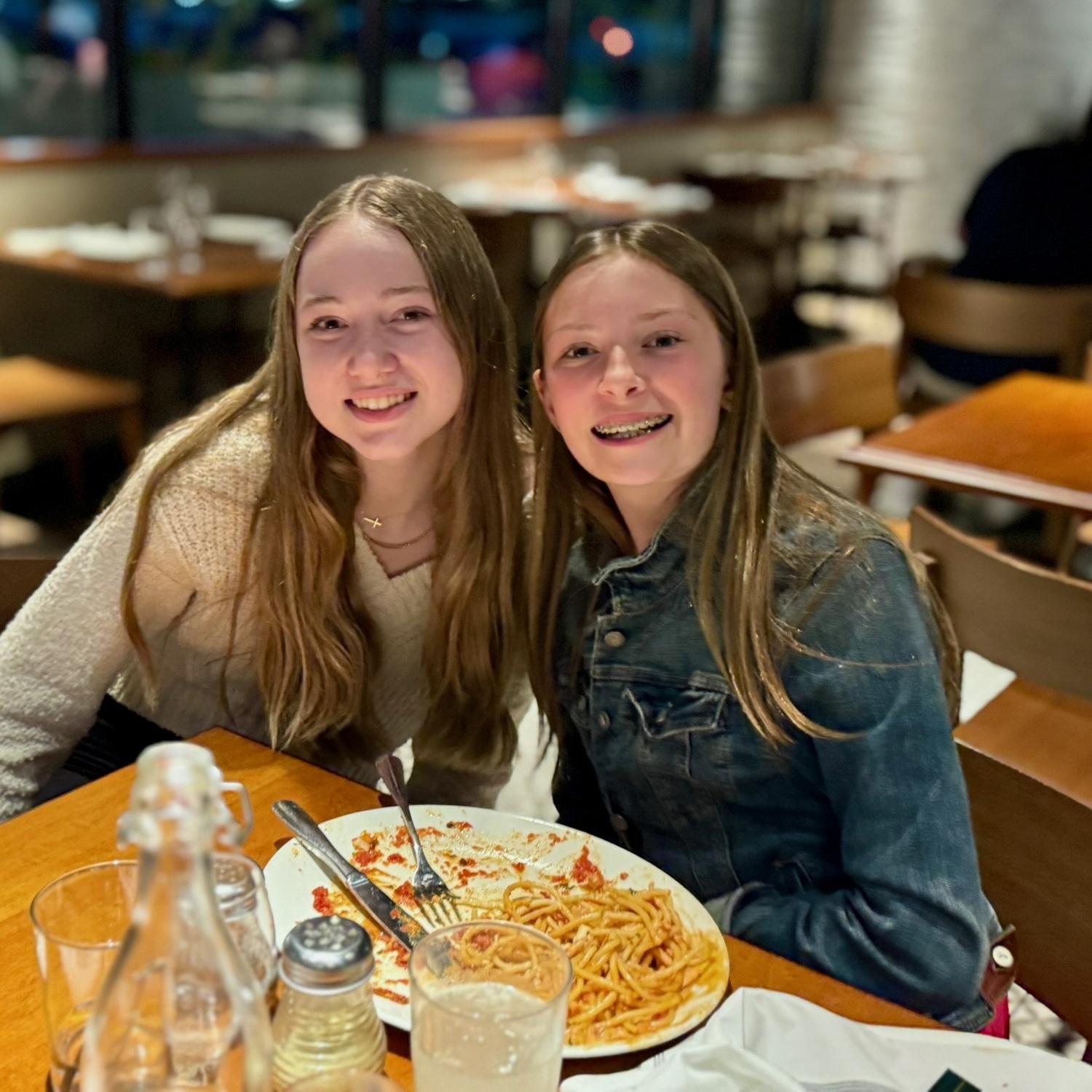 Maddie (Kristen's sister) and Aven (Sean's cousin) at the engagement dinner. They are the same age and get along well.