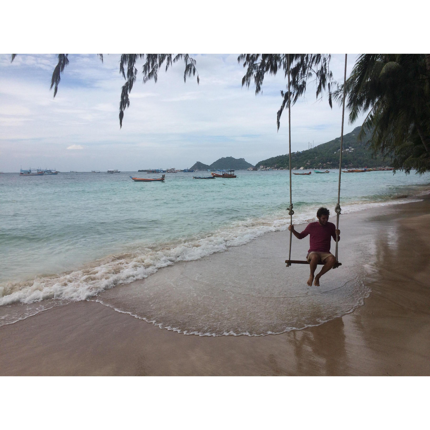 Alex on a swing while we search for breakfast on Ko Tao Island, Thailand