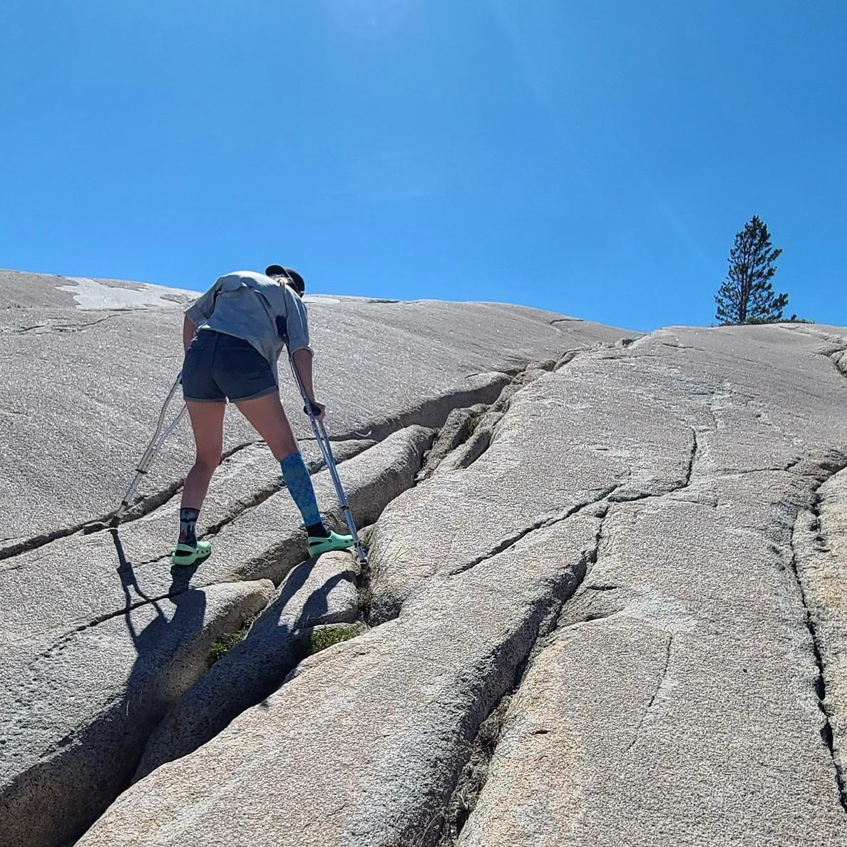 A broken ankle didn't stop Jen from trying to scramble up some rocks.