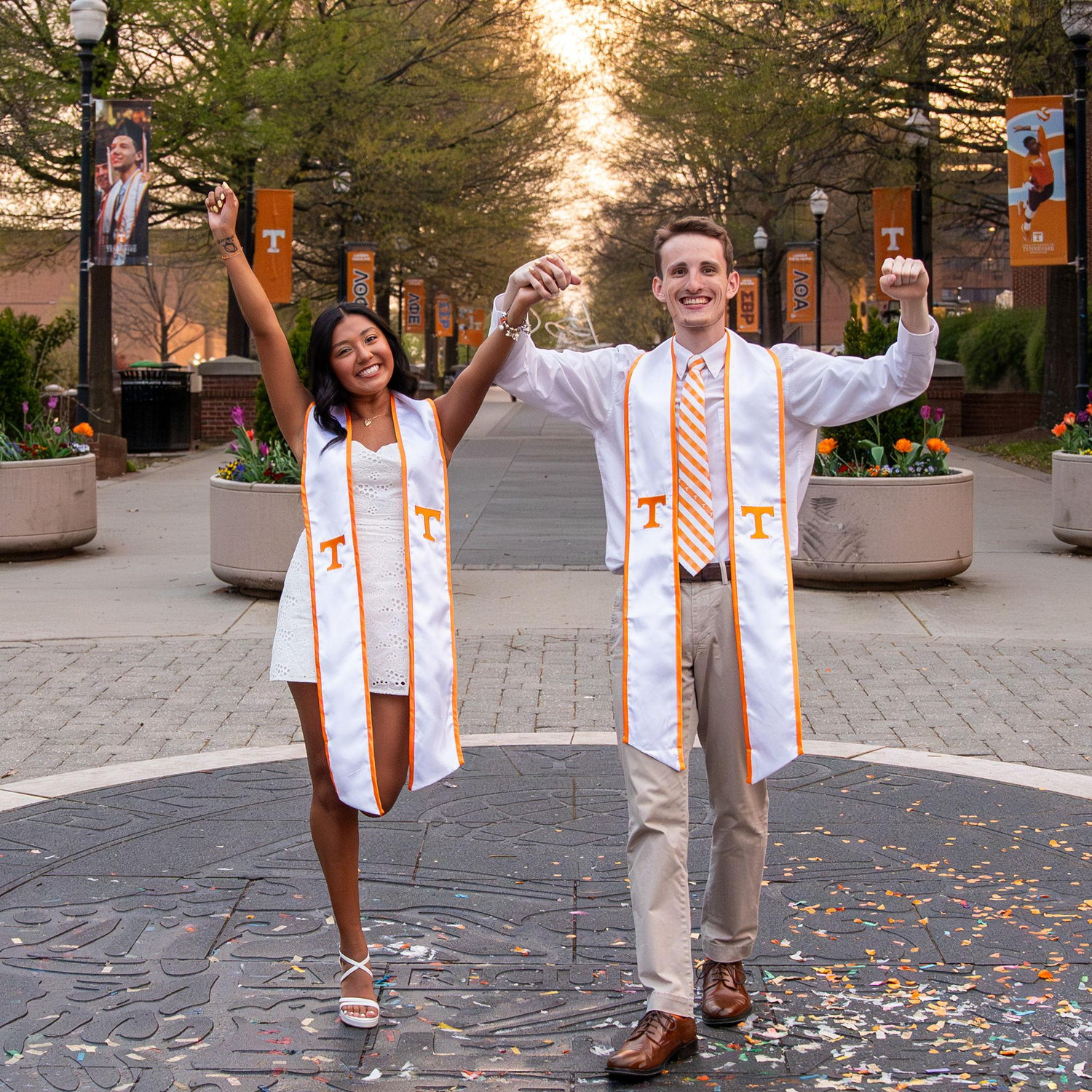 Our first time walking on the sacred UTK seal! 

{It is said if you walk on the seal you won't graduate in 4 years, so students wait until grad photos to take our first step!}