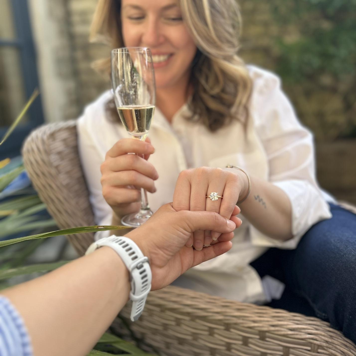 Enjoying champagne right after Kezia proposed!