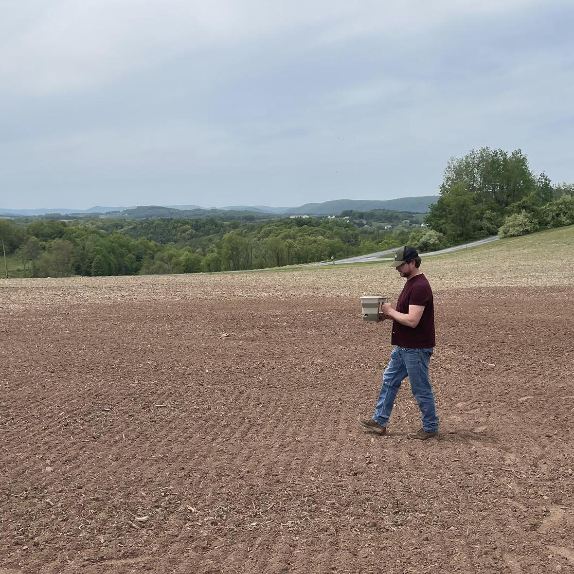 Spreading grass seed with care - thanks Chad and Mr. Cropper for creating our venue space! (May)