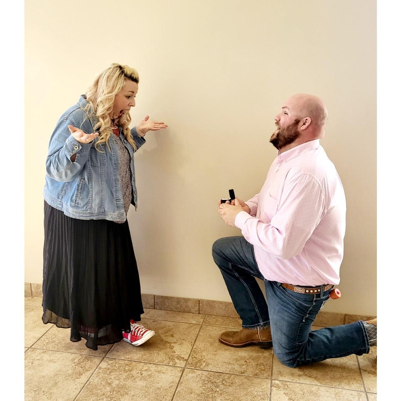 To be transparent, this was a re-enactment because there can never be enough pics of this special moment. We first met at church, so he found it appropriate to propose at church. Perfect for me!