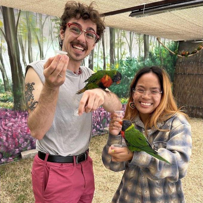Lorikeets and BIG grins! They are so sweet! Thanks mom for buying us more food after they demolished it! LOL
