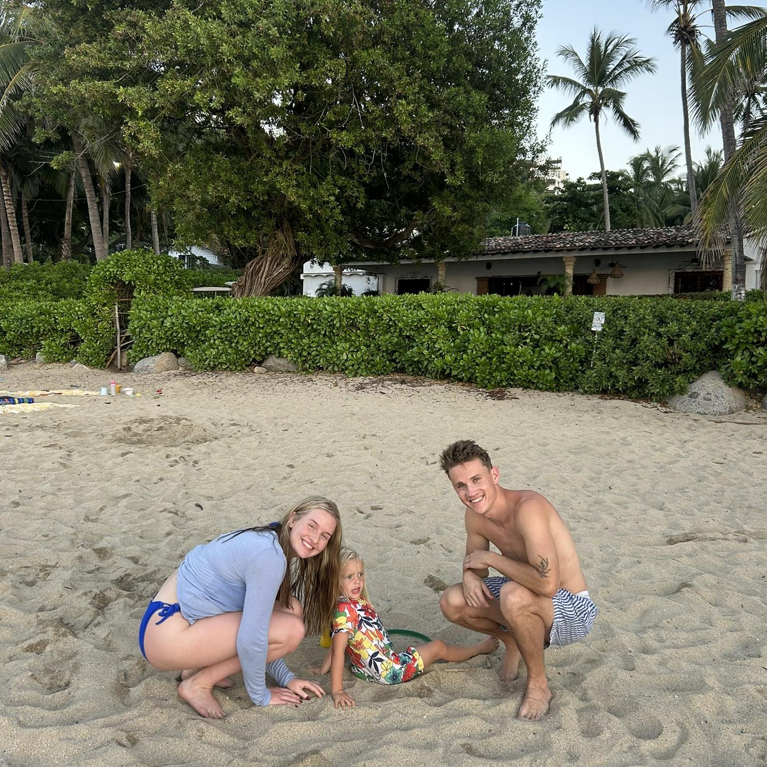 In Mexico desperately trying to get Nova to take a picture... she was busy with her sand