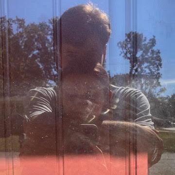 We both like looking at the reflection in the glass door at Anna's house