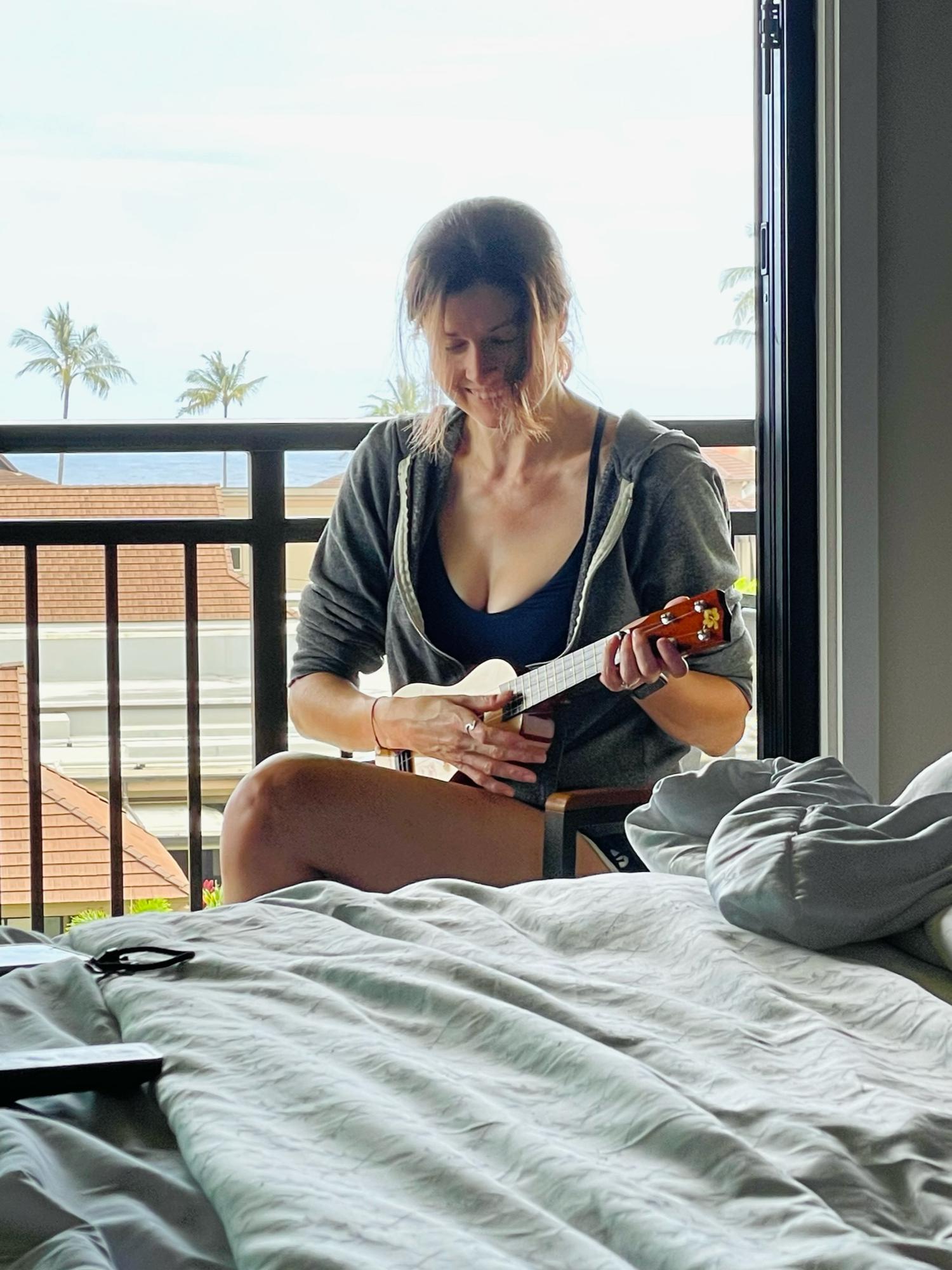 Strumming her first ookoo.
