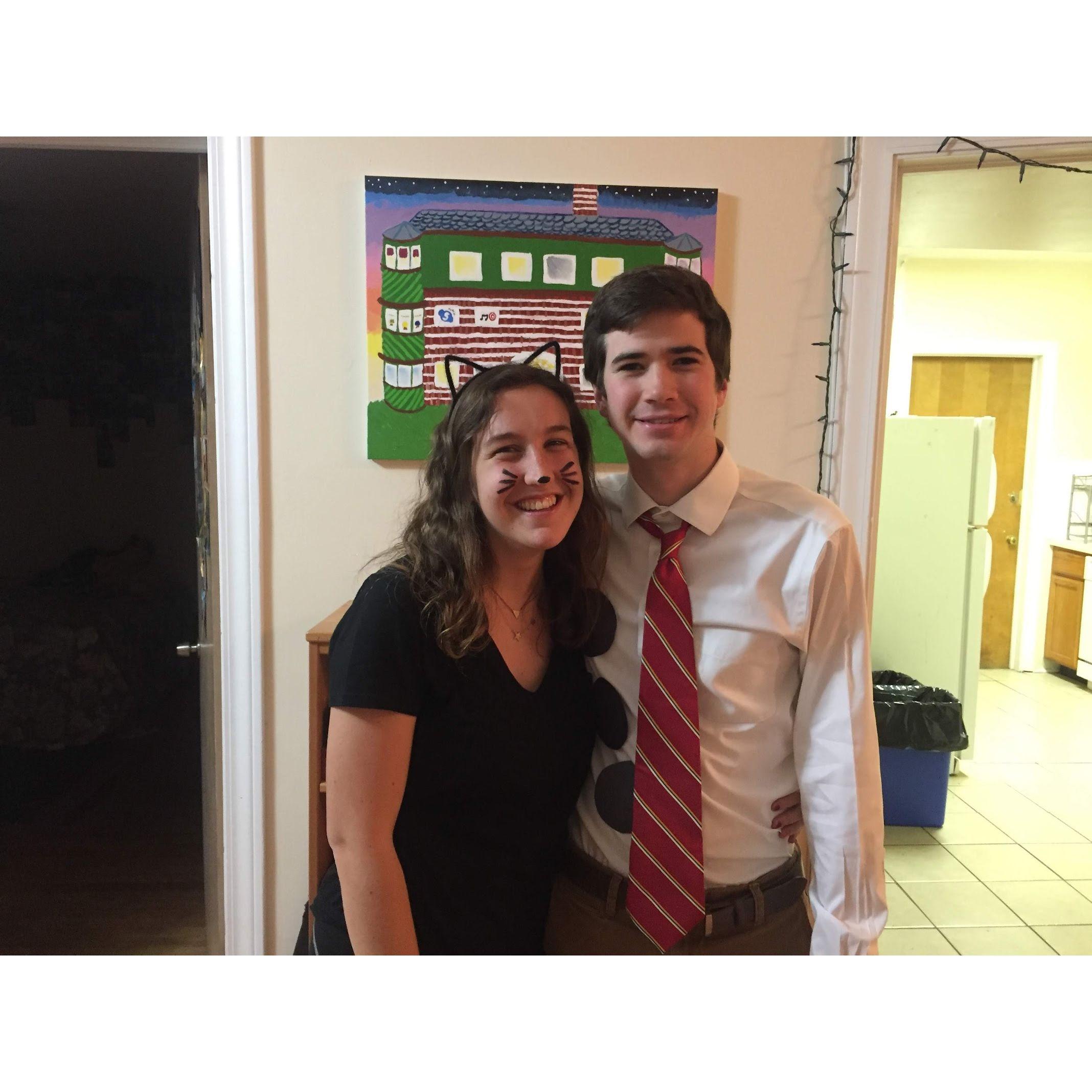 Our first couples halloween costume together: Pam as a cat and Jim as 3 hole punch Jim from The Office on halloween. How meta of us!