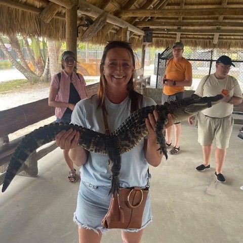 Debbie's "side hustle" is wrangling gators. She is from Florida after all.