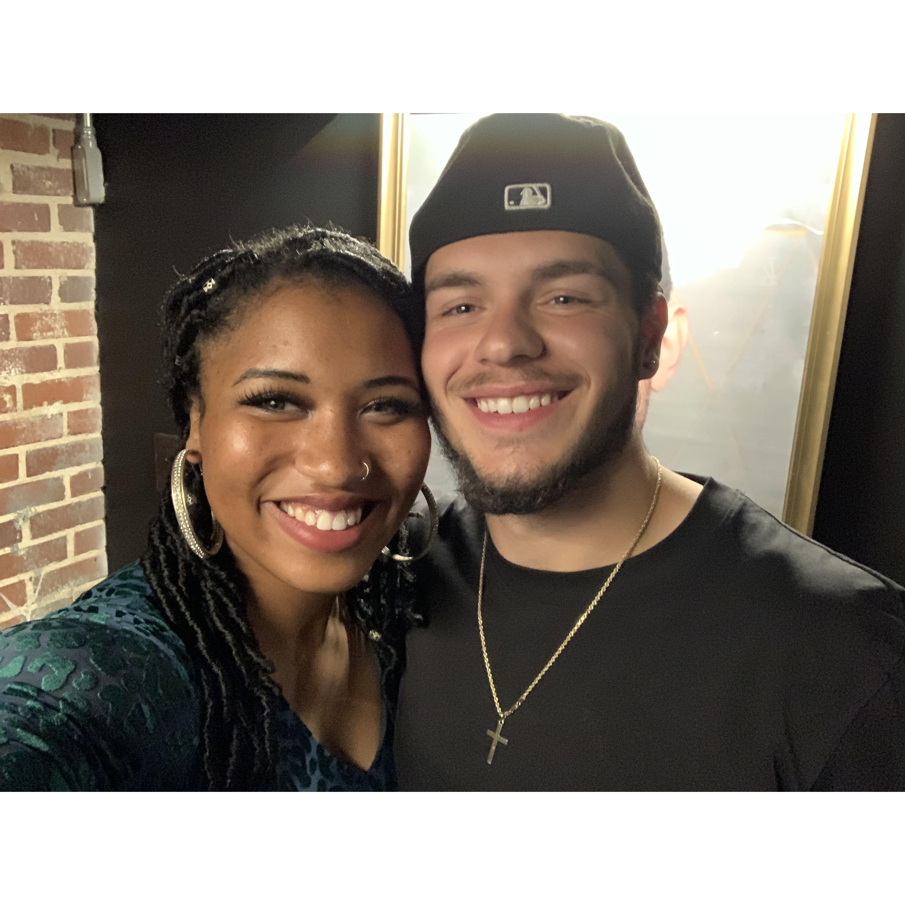 Celebrating our 6 month dating anniversary at an underground comedy show in Charlotte, NC.