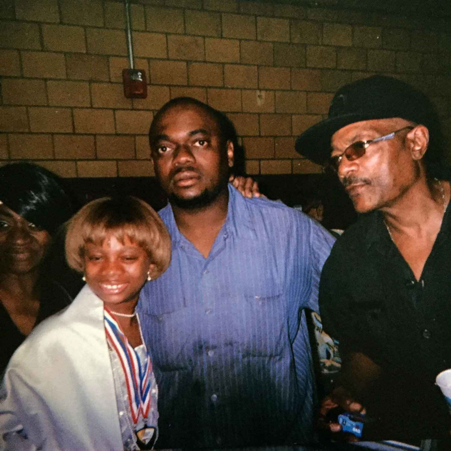 Kyla, dad, granddaddy and grandma Lisa at Kyla’s 5th grade graduation