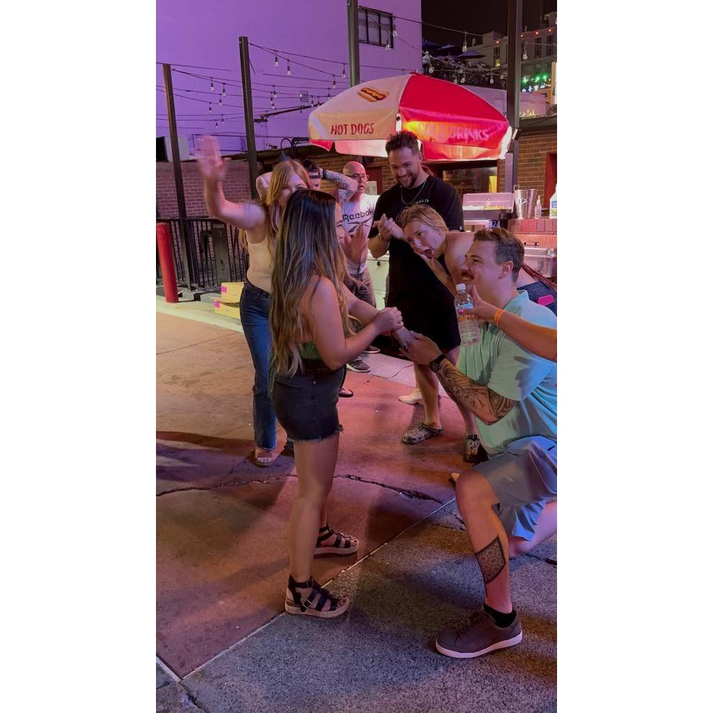 Ricky re-proposing to Jasmine in front of a hotdog stand in Nashville LOL
