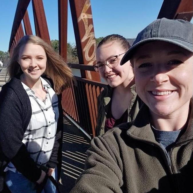 Abbi, Julia, and Alyssa enjoying the walking bridges in Little Rock.