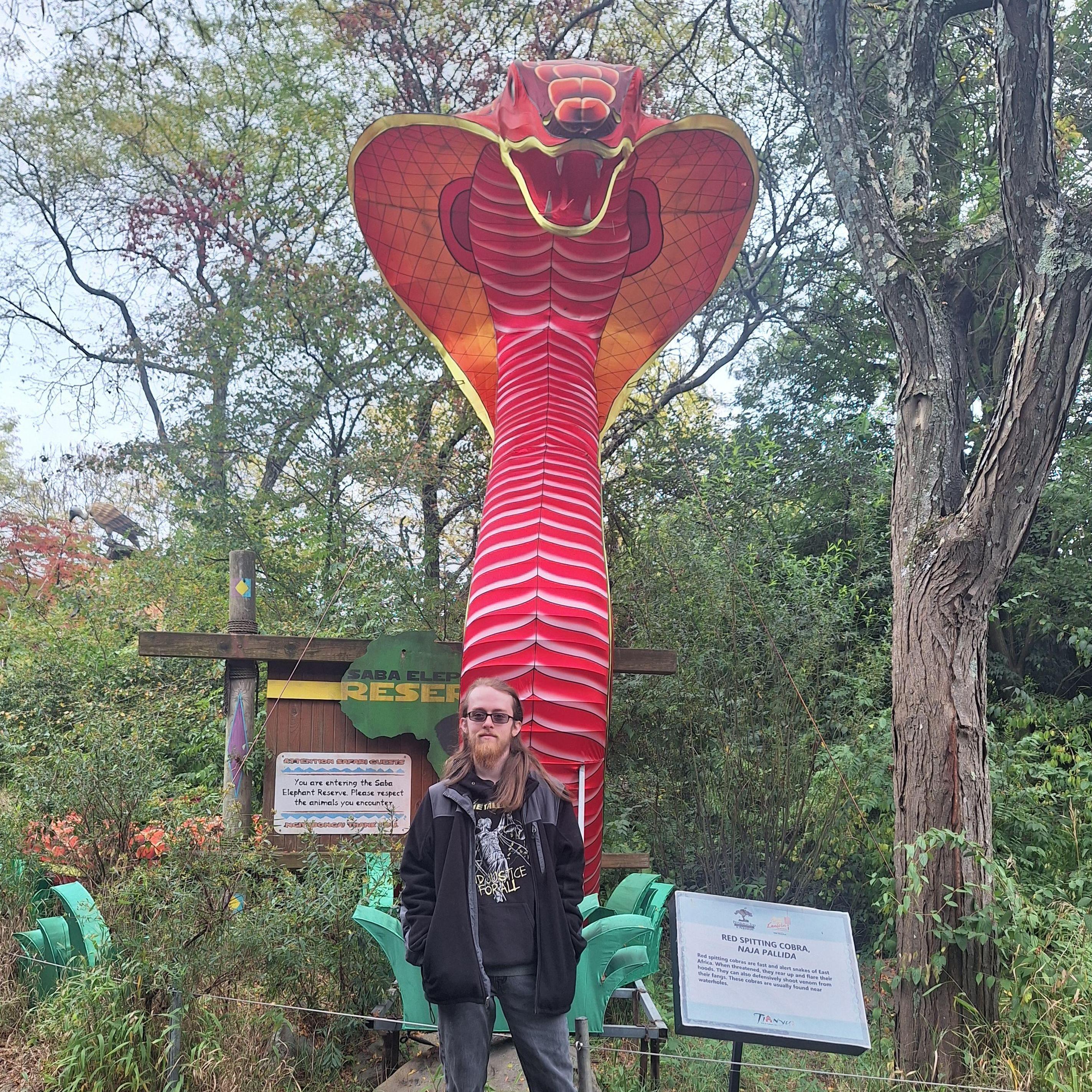 Jay in front of the viper statue