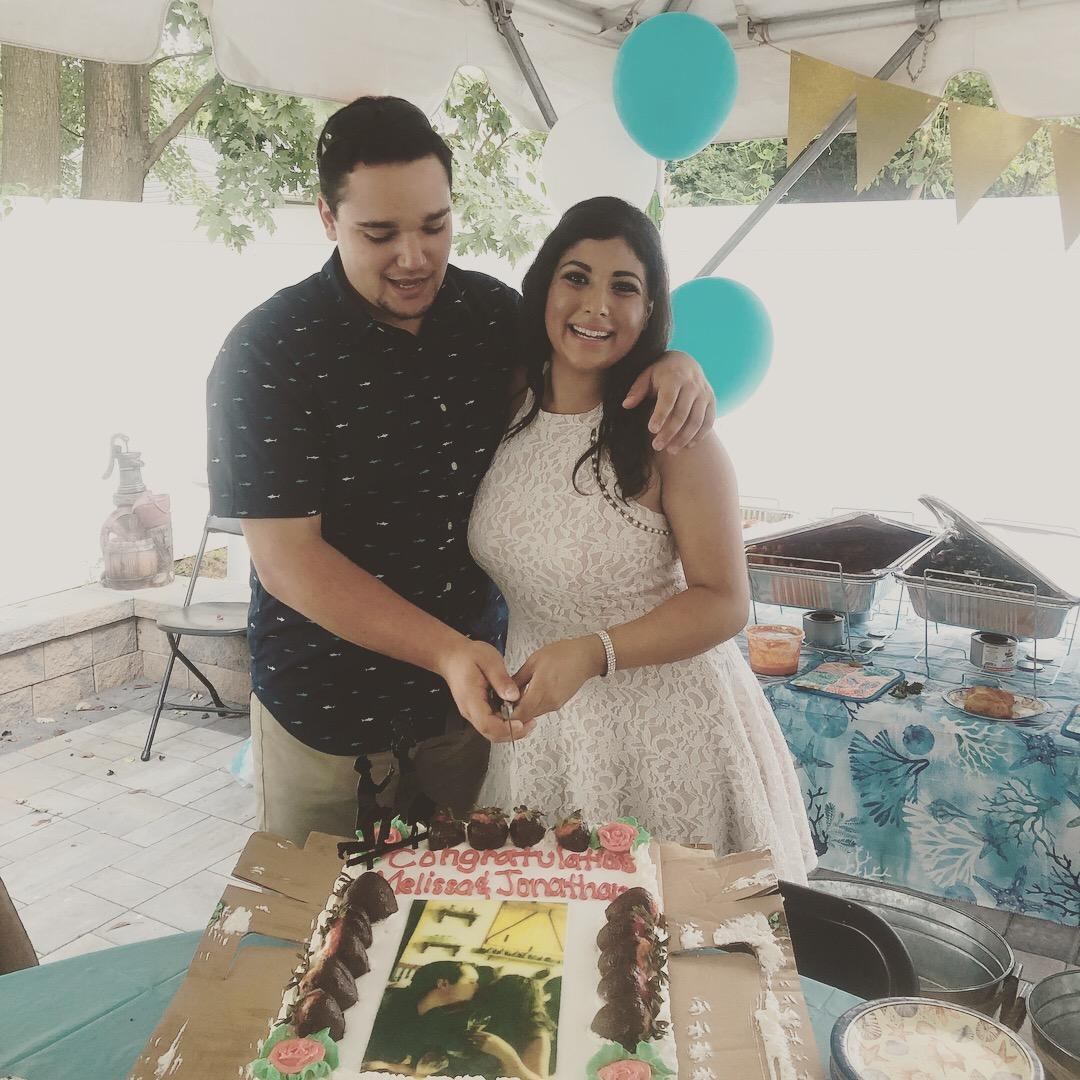 Cutting our cake at our engagement party!