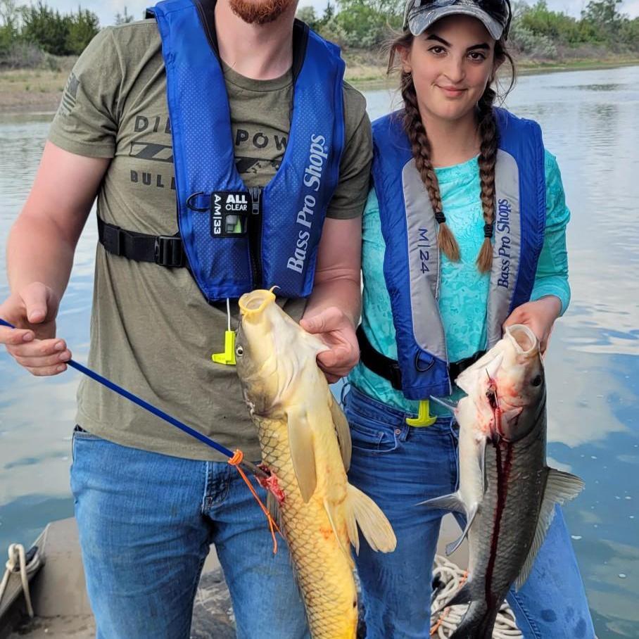 Austin's first time bowfishing on the Missouri where he'd later propose!