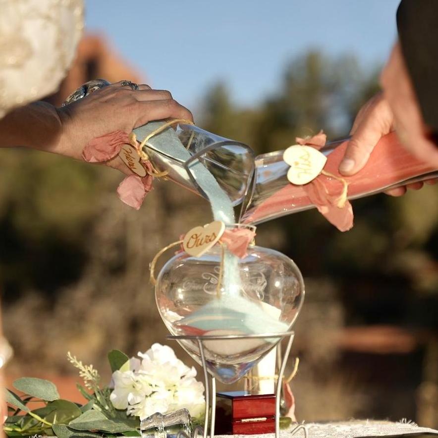 We had a beautiful Unity Sand Ceremony, representing the Bride and Groom coming together with God in marriage