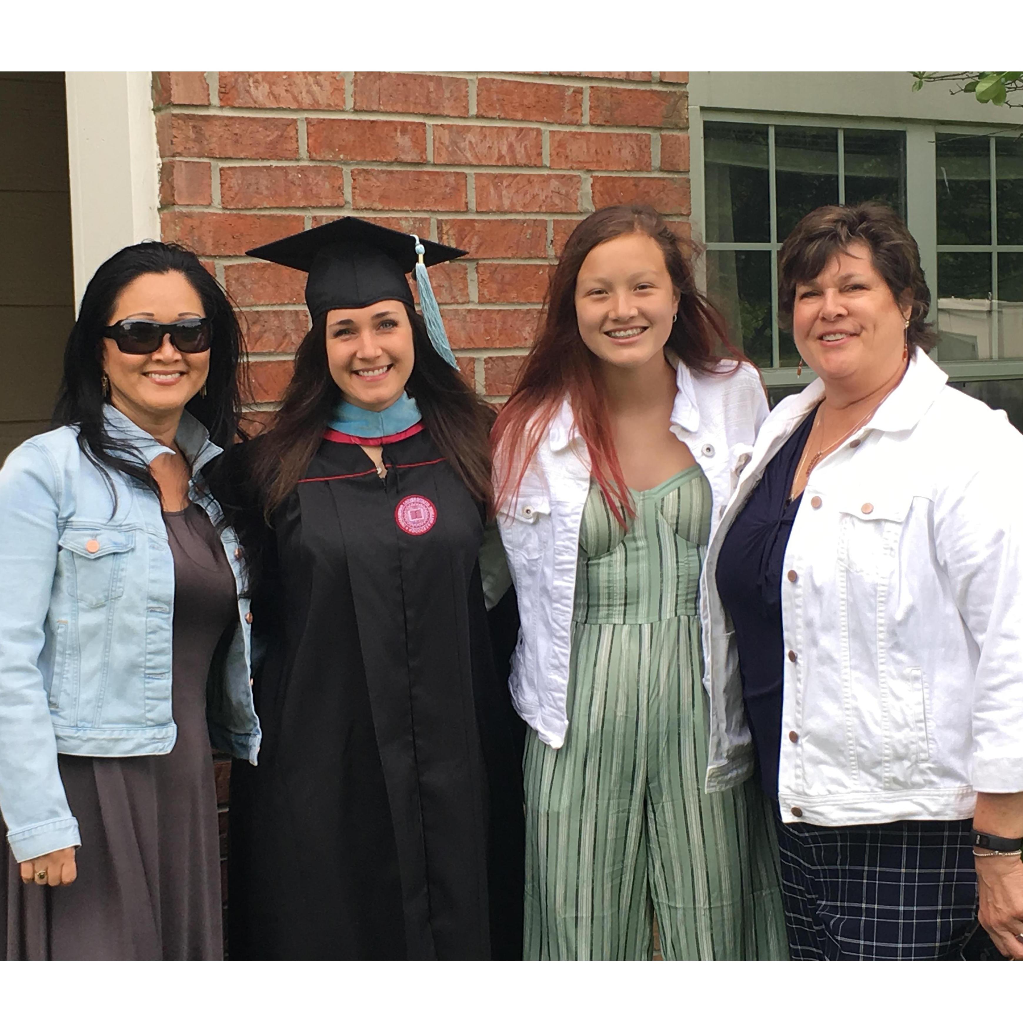 Family helping Elizabeth celebrate getting her master's!