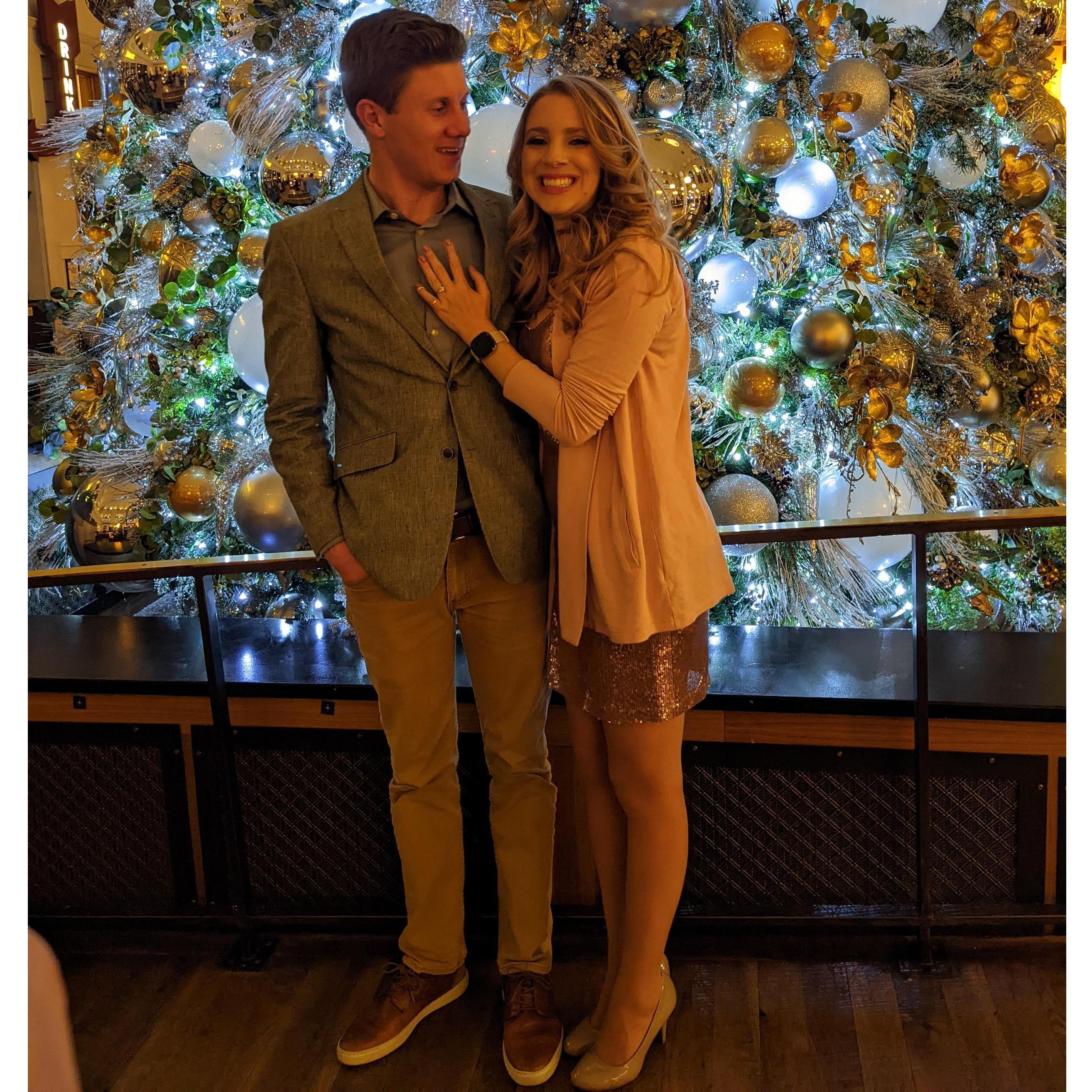 Engaged and excited by the Christmas tree in Union Station