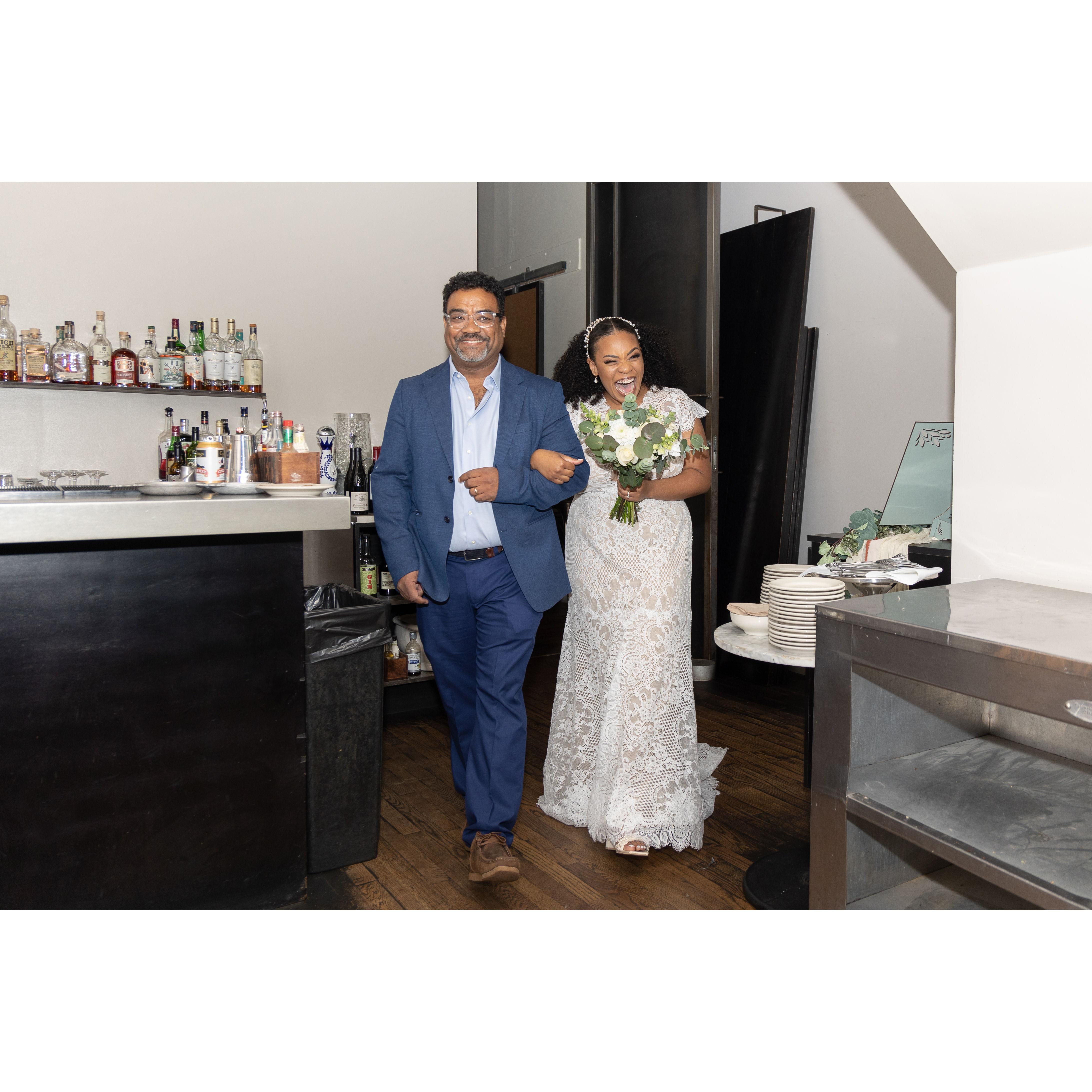 Bride and the Father of the Bride walking in! They had their Father Daughter dance to "A Whole New World" from Aladdin. 
